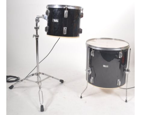 Two retro vintage 20th Century Drum musical instrument lights comprising a larger drum on base and a smaller example raised o