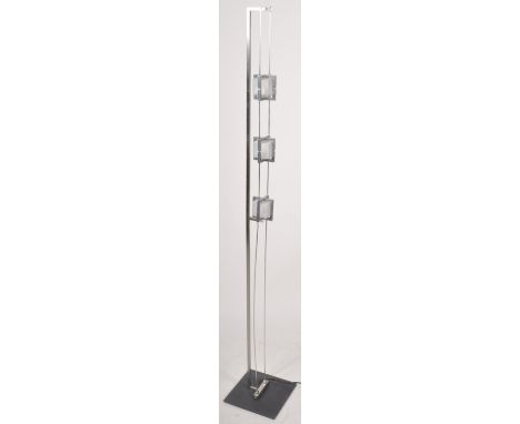 A late 20th Century Italian design contemporary modernist floor standing lamp comprising of a brushed metal square column ove