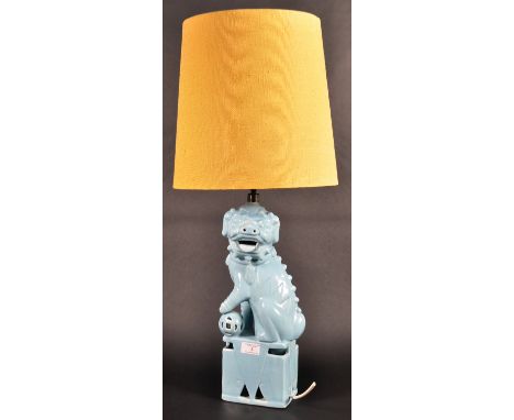 Casa Pupo - A mid 20th Century designer ceramic table lamp light in the form of a foo / fu dog with his paw resting upon a ba
