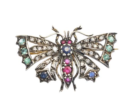 A diamond and gem-set butterfly brooch, designed with a circular shape ruby and sapphire abdomen, and diamond, emerald and sa