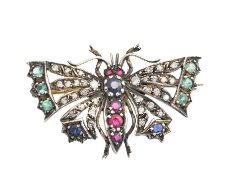 A diamond and gem-set butterfly brooch, designed with a circular shape ruby and sapphire abdomen, and diamond, emerald and sa