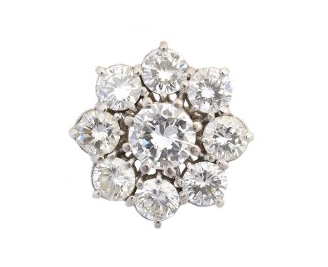 An 18ct gold diamond cluster ring, the brilliant cut diamond within a similarly cut diamond surround, principal diamond estim