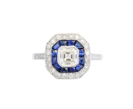 A diamond and sapphire cluster ring, the Asscher cut diamond within a calibré cut sapphire and single cut diamond surround, t