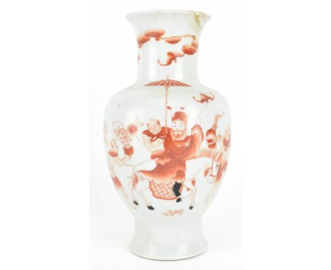 A Qing dynasty iron-red over glaze ceramic vase. The baluster vase decorated a scene of ZhongKui riding on a horse company by