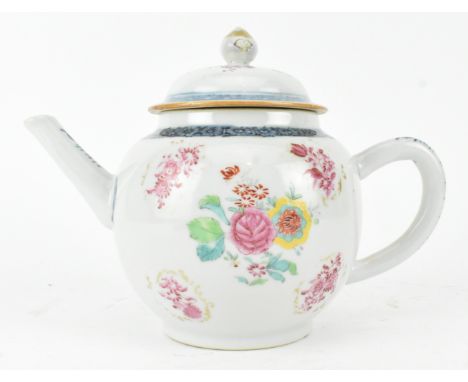 A Qing dynasty 18th century ceramic famille rose teapot with cover. The globular shaped tea pot decorated with scrolls of flo