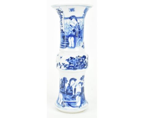 A Qing dynasty blue and white Gu shaped ceramic vase. The vase has a flared mouth rim decorated with a maiden reading in the 