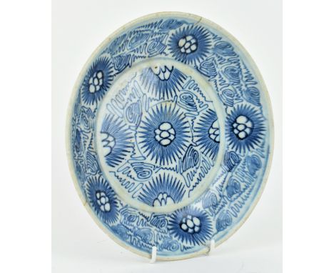 A Qing dynasty Jiaqing Daoguang period blue and white ceramic charger plate. The plate decorated with abstract Sunflower desi