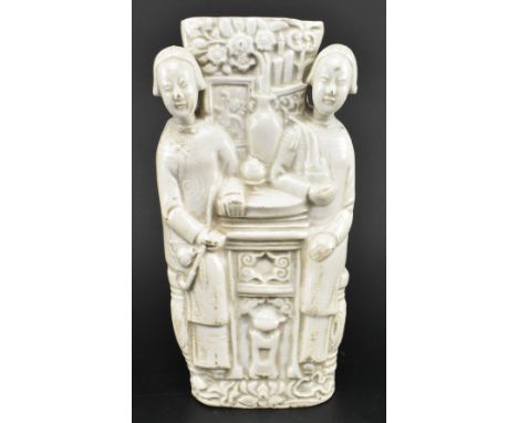 A late Qing dynasty early Republic period blanc de Chine ceramic wall pocket planter. The wall pocket planter modelled in a f