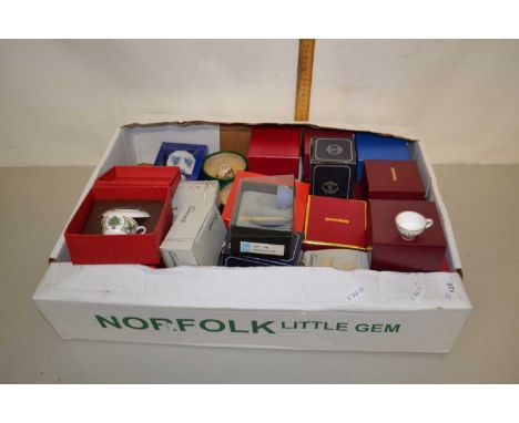 A collection of boxed miniature cups and saucers to include examples by Royal Worcester, Caverswall, Wedgwood and others