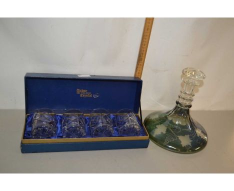 Green tinted flat bottomed decanter and a case of four tumblers