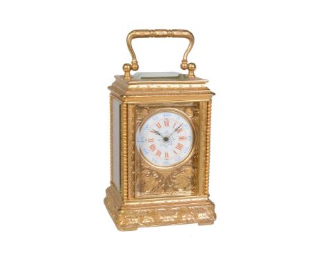 A fine French engraved gilt brass miniature carriage timepiece   Unsigned, Paris, late 19th century   The eight-day single tr