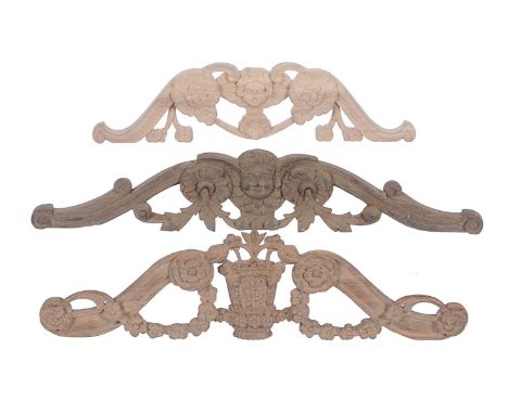Two carved walnut longcase clock pediment crest ornaments   For use in the restoration of longcase clock cases dating from 16