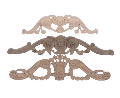 Two carved walnut longcase clock pediment crest ornaments   For use in the restoration of longcase clock cases dating from 16