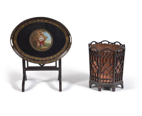 An ebonised and parcel gilt jardinière, early 20th century, the octagonal body with pierced fretwork sides enclosing a remova