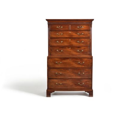 A George III mahogany secretaire chest on chest, third quarter 18th century, the dentilled cornice with a fretwork and patera