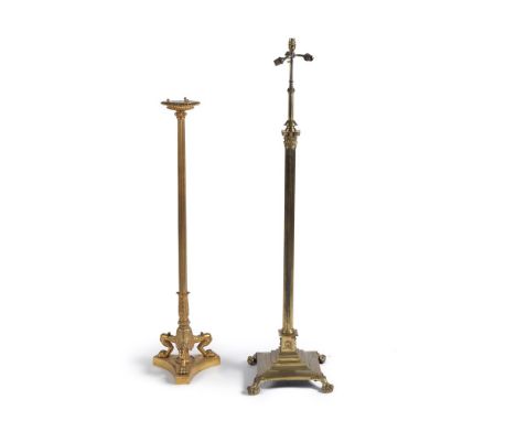 A gilt metal standard lamp base in the manner of Thomas Hope, early 20th century, the lobed top above a reeded stem, descendi