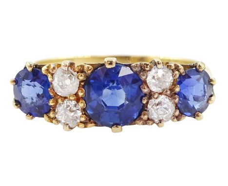 Early 20th century 18ct gold three stone cushion cut sapphire and four stone old cut diamond ring, total sapphire weight appr
