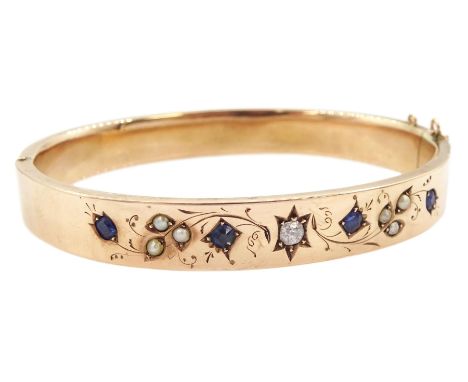 Early 20th century 9ct rose gold sapphire, old cut diamond and pearl hinged bangle, with foliate decorationCondition Report:A