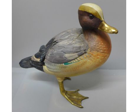 A wooden model of a Mallard Duck with brass feet and bill 