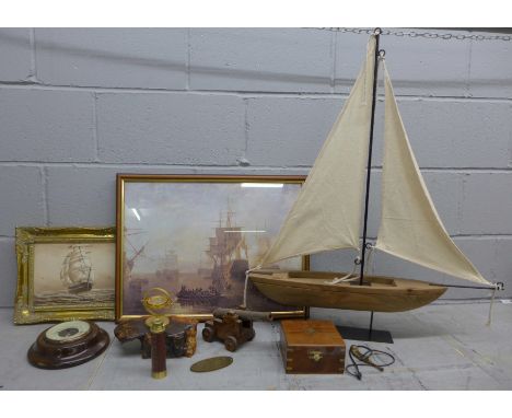 A mixed lot of nautical items, model boat, framed prints, telescope, model cannon, bosun's whistle and a Short &amp; Mason ba