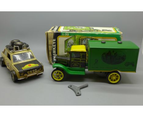 A John Deere Hawkeye clockwork truck, boxed and a Fiat Africa Safari 4x4 model vehicle 