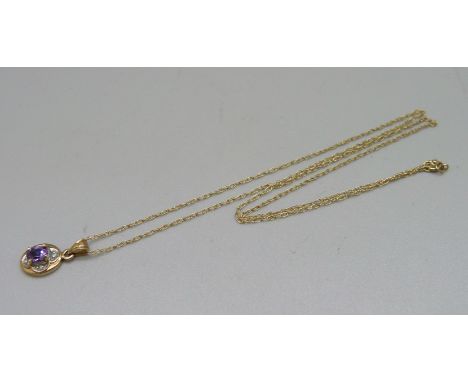 A 9ct gold pendant set with diamonds and an amethyst on a fine 9ct gold chain, 1.3g 