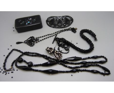 Victorian items; French jet hair clip, a long necklace, one other necklace, Albert chain, knot brooch and a papier mache box 