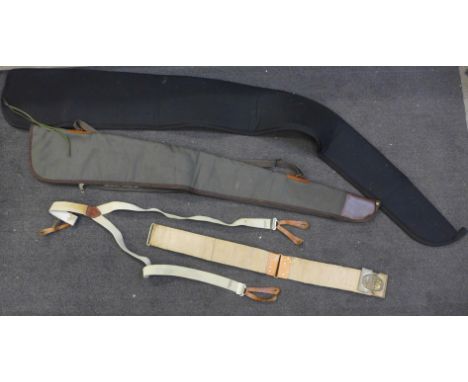 An 1880's trapdoor Springfield rifle ammunition belt made for 45/70 rifle, a pair of braces, a canvas rifle bag and one other