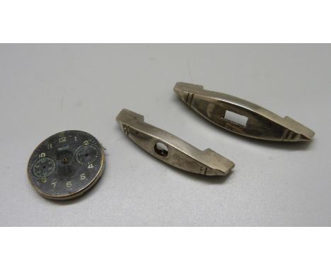 A Hanhart Luftwaffe chronograph dial/part movement and two dagger cross guards 