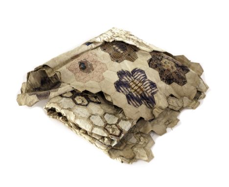 A 19th century patch work cover, having shaped edges, made up of various decorative hexagonal patches