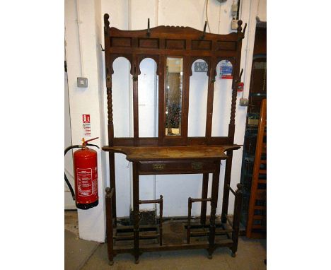 A late Victorian oak hallstand, with brass handles over single drawer, and twin tray stick stand base 203cm H