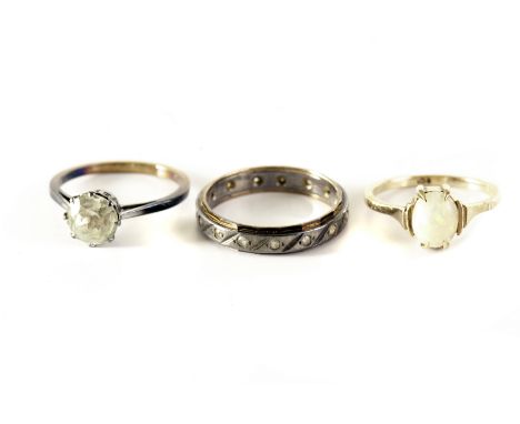 A 9ct white opal ring, plus two other  rings marked gold and silver (3)