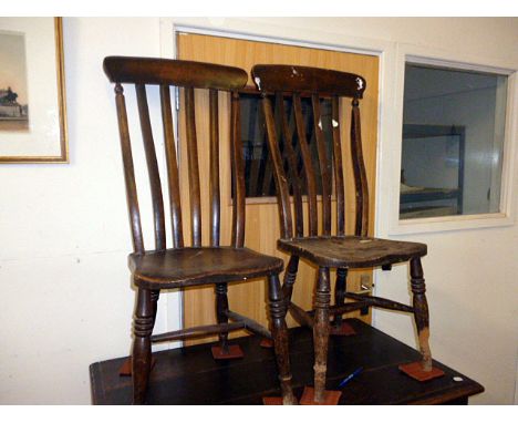 A pair of 19th century comb back country kitchen chairs, with elm seats