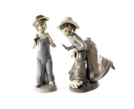 A Lladro figure entitled 'Boy from Madrid', 4898, together with a Nao figure of a girl looking for her puppy