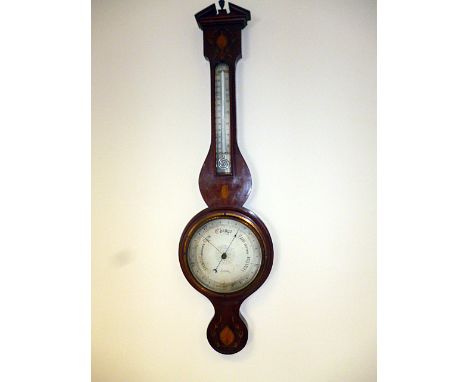 An inlaid mahogany banjo thermometer/barometer, by C.S.S.A Ltd of London, having leaf and foliate inlaid decoration