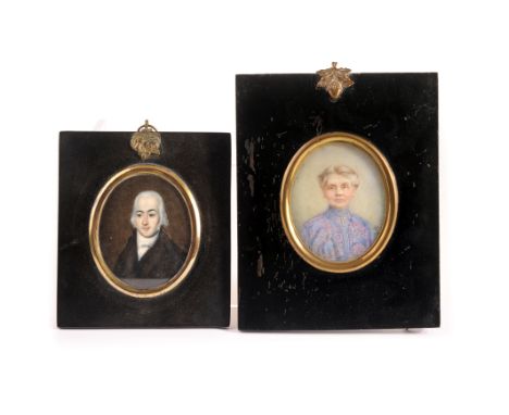 An early 20th century portrait watercolour miniature on ivory,  of a distinguished lady initialled EW and indistinctly dated 