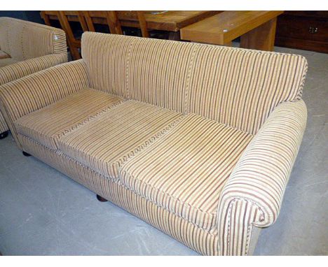 A three seat roll arm sofa upholstered in striped fabric