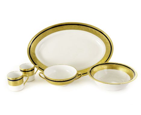 A Limoges porcelain La Farge double gold part service, comprising of graduated plates, cups, saucers, an oval serving plate a