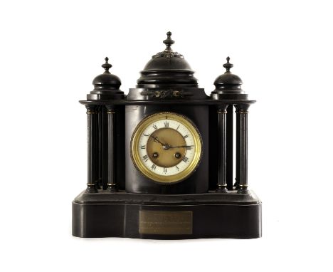 A vintage presentation slate mantle clock, the clock with domed design to top, the dial flanked by architectural column desig