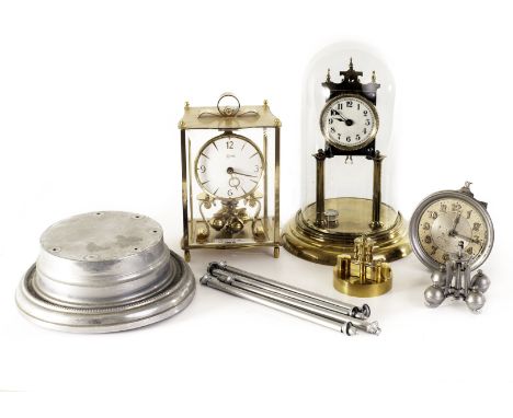A modern Kundo 400 hour mantle clock,  together with an early 100 hour example the brass architectural fittings under a glass