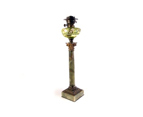 A 19th century onyx and brass oil lamp, with hand blown glass reservoir, the resevoir with hand painted enamel floral decorat