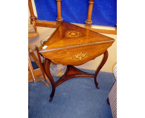 A Victorian rosewood triangular drop leaf table, on tripartite base with shelf stretcher