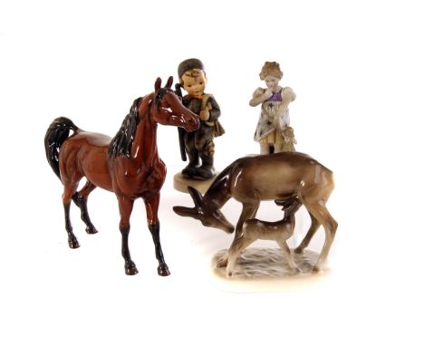 A group of ceramic figures, including two Beswick horses, and a selection of Hummel figures (parcel)