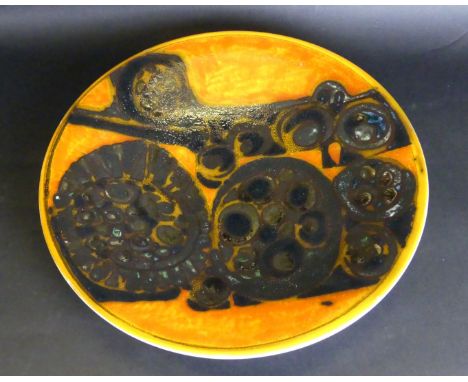 A Poole Pottery Delphis wall chargerDecorated with stylised abstract motifs on an orange ground, blue factory marks and paint