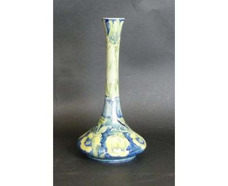 A William Moorcroft vase of bulbous form with cylindrical neckDecorated in the 'Florian Ware' pattern with yellow tulip on a 