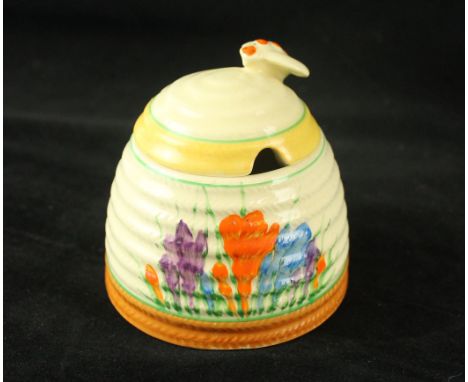A Clarice Cliff Newport Pottery Beehive honey potDecorated in the 'Crocus' pattern, factory marks to base, height 10cm   COND