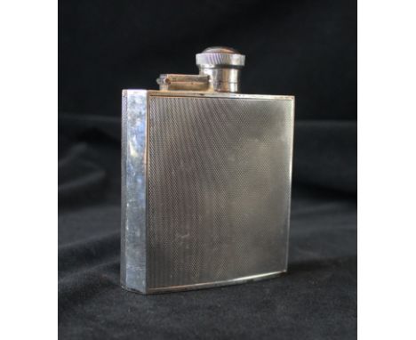 An Art Deco hallmarked silver hip flask Having engine turned decoration, by James Dixon & Sons Sheffield 1940, approx weight 