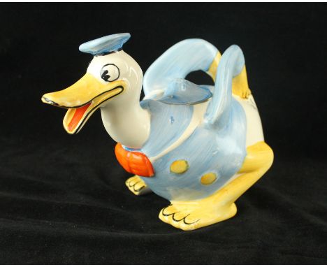 An Art Deco Wadeheath Walt Disney novelty teapot 'Donald Duck' printed factory marks to base, height 17cm   CONDITION REPORT: