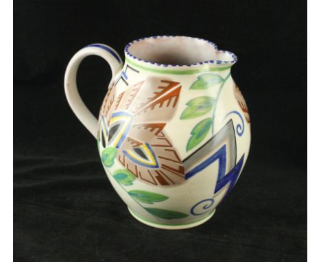A Poole Pottery Art Deco jug of bulbous formHand painted with geometric floral decoration, impressed factory marks and painte