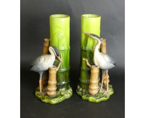 A pair of Bretby Aesthetic movement vases Each modelled in the form of storks beside bamboo, impressed factory marks to base,